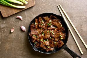 Cooked beef meat in asian style. Mongolian beef.
