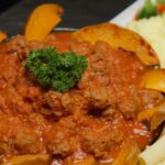 Mini Beef meatballs in a rich tomato sauce with Rigatoni pasta and pumpkin fingers